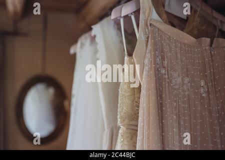 Wedding dresses hanging on coathanger Stock Photo