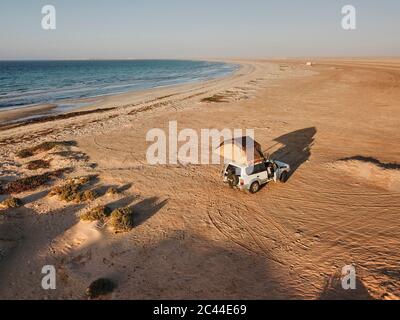 Mauritania, Banc dArguin National Park, Aerial view of off road car with rooftop tent on desert Stock Photo