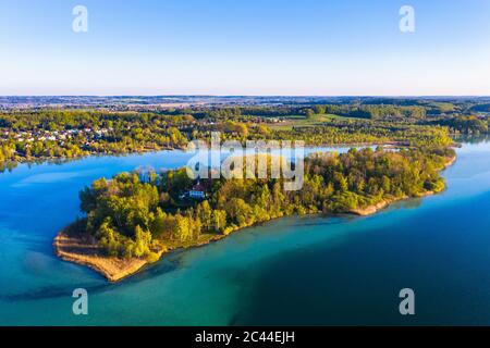 Germany, Bavaria, Inning am Ammersee, Drone view of clear sky over forested shore of Worth island Stock Photo