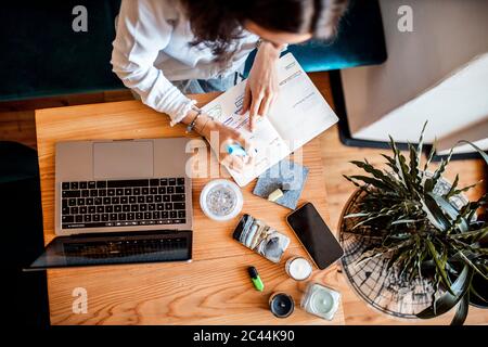 Crop view of young woman working  at home office, top view Stock Photo