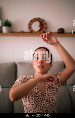 Beautiful woman dancing at home Stock Photo