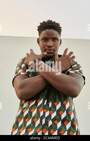 Portrait of young man in patterned shirt posing Stock Photo