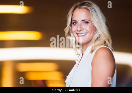 Portrait of smiling young woman Stock Photo