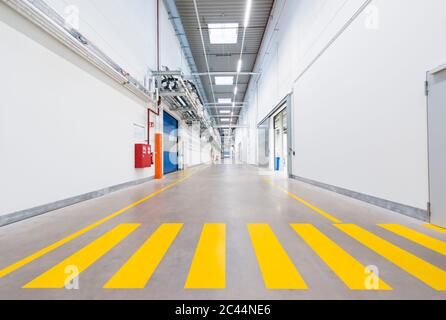 Long corridor in empty factory Stock Photo