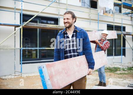 Construction workers working at construction site Stock Photo