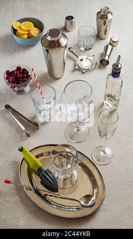 bar tools, Shaker and cocktail glasses, mixology tools on a white table, close up Stock Photo