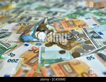 coins fall from the wallet to the table Stock Photo