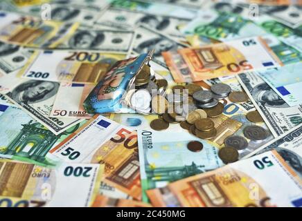 coins fall from the wallet to the table Stock Photo