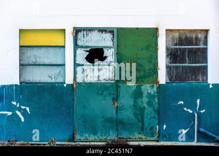 Windows in facade of an neglected workshop Stock Photo