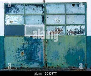 Windows in facade of an neglected workshop Stock Photo