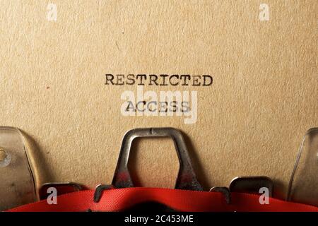 Restricted access text written on a paper. Stock Photo