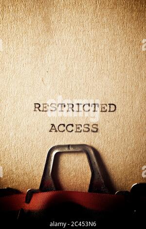 Restricted access text written on a paper. Stock Photo