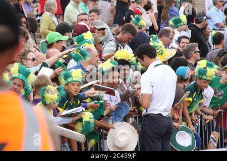 Mitchell Johnson with his moustache signed autographs for Australian fans in front of the Sydney Opera House as they celebrated the 5-0 Ashes Test vic Stock Photo