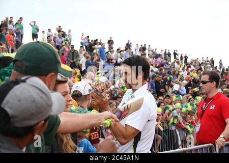 Mitchell Johnson with his moustache signed autographs for Australian fans in front of the Sydney Opera House as they celebrated the 5-0 Ashes Test vic Stock Photo