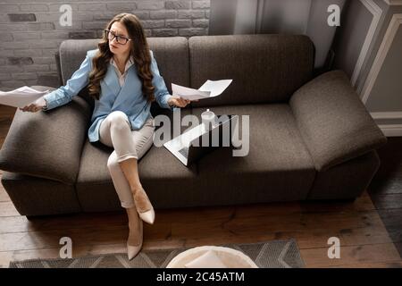 Serious business lady tired from work in the office  Stock Photo