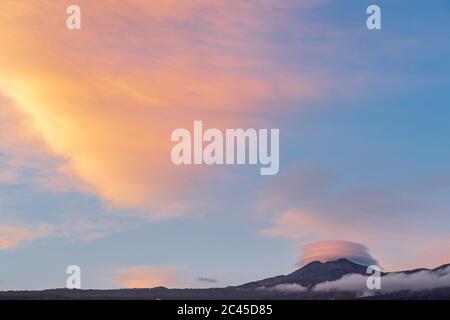 Lenticular cloud over the peak of Teide at sunset seen from Playa San Juan, Tenerife, Canary Islands, Spain Stock Photo