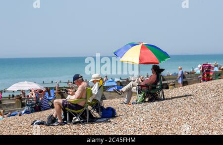 Worthing UK 24th June 2020 - Crowds on the beaches at Ferring near Worthing in West Sussex today as they enjoy the heatwave weather  with temperatures reaching 30 degrees in some parts of the South East   : Credit Simon Dack / Alamy Live News Stock Photo