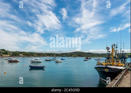 Schull, West Cork, Ireland. 24th June, 2020. Schull is basking in sunshine today, after a day full of rain yesterday. Schull Harbour is slowly starting to fill with relaunched boats after relaxation of the Covid-19 restrictions. Fishing Trawler 'Laetitia' is moored at Schull Pier before a trip to the fishing grounds. Credit: AG News/Alamy Live News Stock Photo