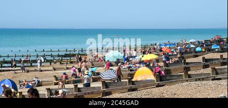 Worthing UK 24th June 2020 - Crowds on the beaches at Ferring near Worthing in West Sussex today as they enjoy the heatwave weather  with temperatures reaching 30 degrees in some parts of the South East   : Credit Simon Dack / Alamy Live News Stock Photo