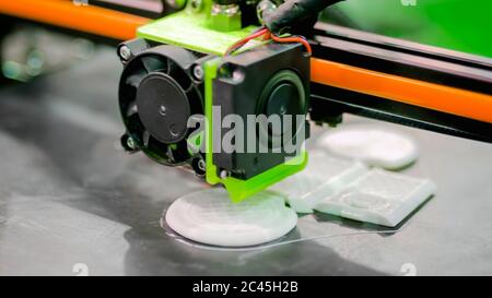 Three dimensional printer during work at 3d science technology exhibition. 3D printing, additive technologies, engineering and prototyping industry Stock Photo