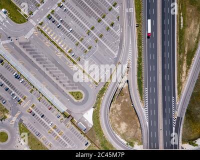 Aerial view of empty car park next to a motorway in Florence, Italy during the Corona virus crisis. Stock Photo