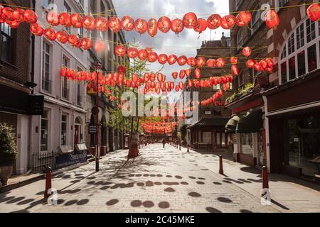 View of empty street in Chinatown decorated with red lanterns during the Corona virus crisis Stock Photo