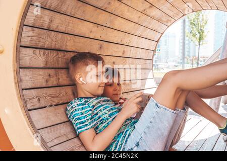 Handsome boy with smartphone playing game Stock Photo