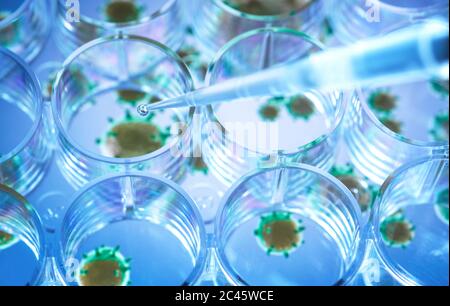 Scientist pipetting a experimental vaccine into a multi well plate with the virus in the background. Stock Photo