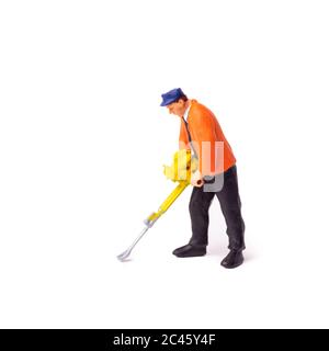 Little People Builder worker with pneumatic hammer drill equipment on whit background Stock Photo
