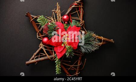 Christmas wreath with dry twigs, pine branches, red balls Stock Photo