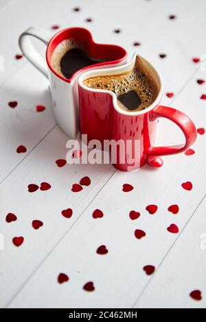 Two heart shaped coffee cups conected with each other. Stock Photo