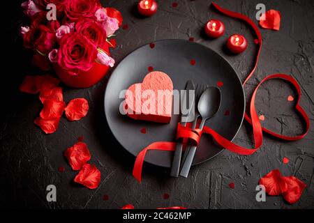 Valentines day, table setting and romantic dinner concept. Stock Photo