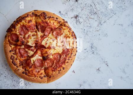 Pizza pepperoni with mozzarella cheese, tomato sauce and salami Stock Photo