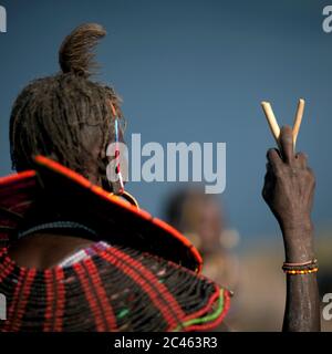 A pokot woman wears large necklaces made from the stems of sedge grass, Baringo county, Baringo, Kenya Stock Photo