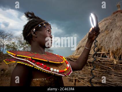 A pokot woman wears large necklaces made from the stems of sedge grass, Baringo county, Baringo, Kenya Stock Photo