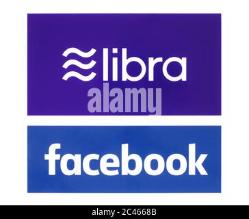 Kiev, Ukraine - June 19, 2019: Facebook and Libra logos printed on paper. Libra is a proposed permissioned blockchain virtual currency by the American Stock Photo