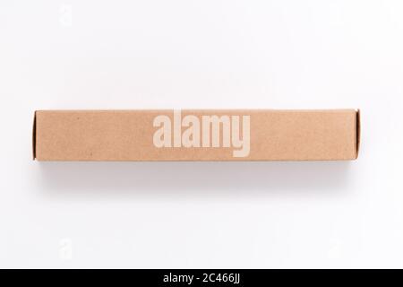 Oblong cardboard box on white background. Mock-up image. Flat lay, top view Stock Photo
