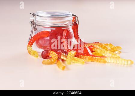 Colorful jelly worms snakes in a glass jar Stock Photo