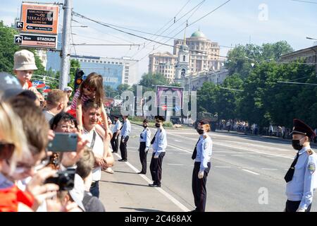 Donetsk, Donetsk People Republic, Ukraine - June 24, 2020: A crowd of people with women and children takes pictures and videos during the movement of Stock Photo