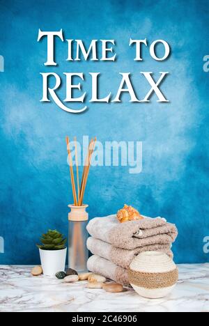 Spa objects and elements on a marble table and blue background Stock Photo