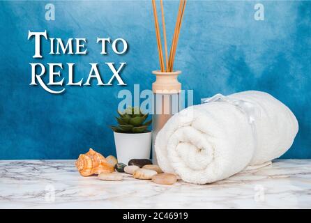 Spa objects and elements on a marble table and blue background Stock Photo