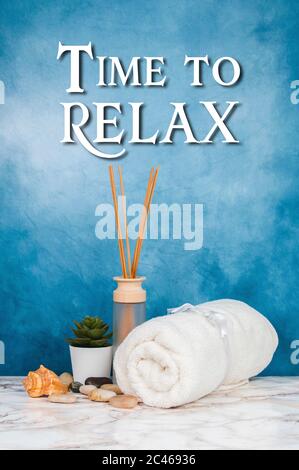 Spa objects and elements on a marble table and blue background Stock Photo