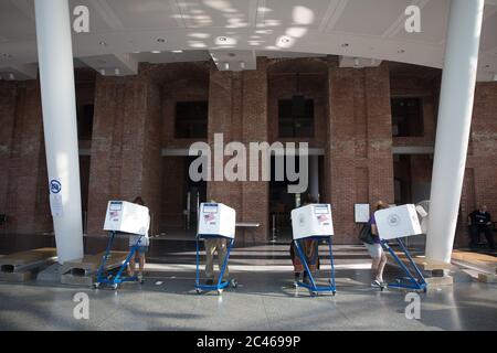 New York, USA. 23rd June, 2020. People vote at a polling site in Brooklyn borough of New York, the United States, June 23, 2020. New York held 2020 primary elections on Tuesday. Credit: Michael Nagle/Xinhua/Alamy Live News Stock Photo