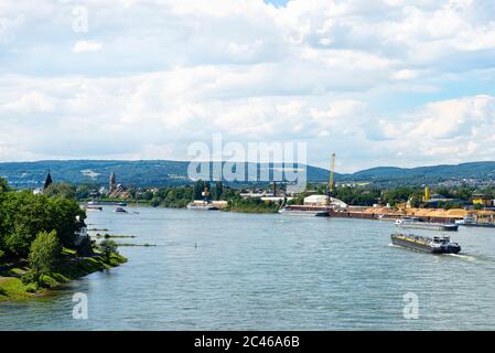 A large tanker ship sailing in Germany on the Rhine River. Transportation of oil, gas and gasoline, visible loading port, heavy sea traffic. Stock Photo