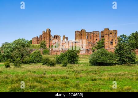 A southern view of the ruins of Kenilworth Castle across the Great Mere, Warwickshire, England Stock Photo