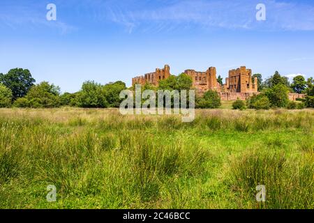 The ruins of Kenilworth Castle from the south west from the Great Mere, Warwickshire, England Stock Photo