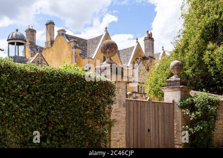 A glimpse of 16th century (1590) Ablington Manor in the Cotswold village of Ablington, Gloucestershire UK Stock Photo