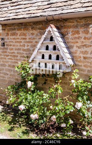 A miniature dovecote in the Coln Valley in the Cotswold village of Winson, Gloucestershire UK Stock Photo