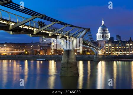 Millennium Bridge over River Thames and St Paul's Cathedral at dusk, London, England, United Kingdom, Europe