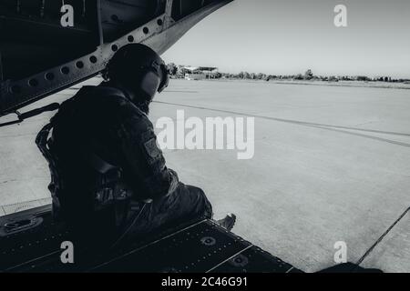 Amazing shot of an airborne forces soldier going to jump from an airplane Stock Photo